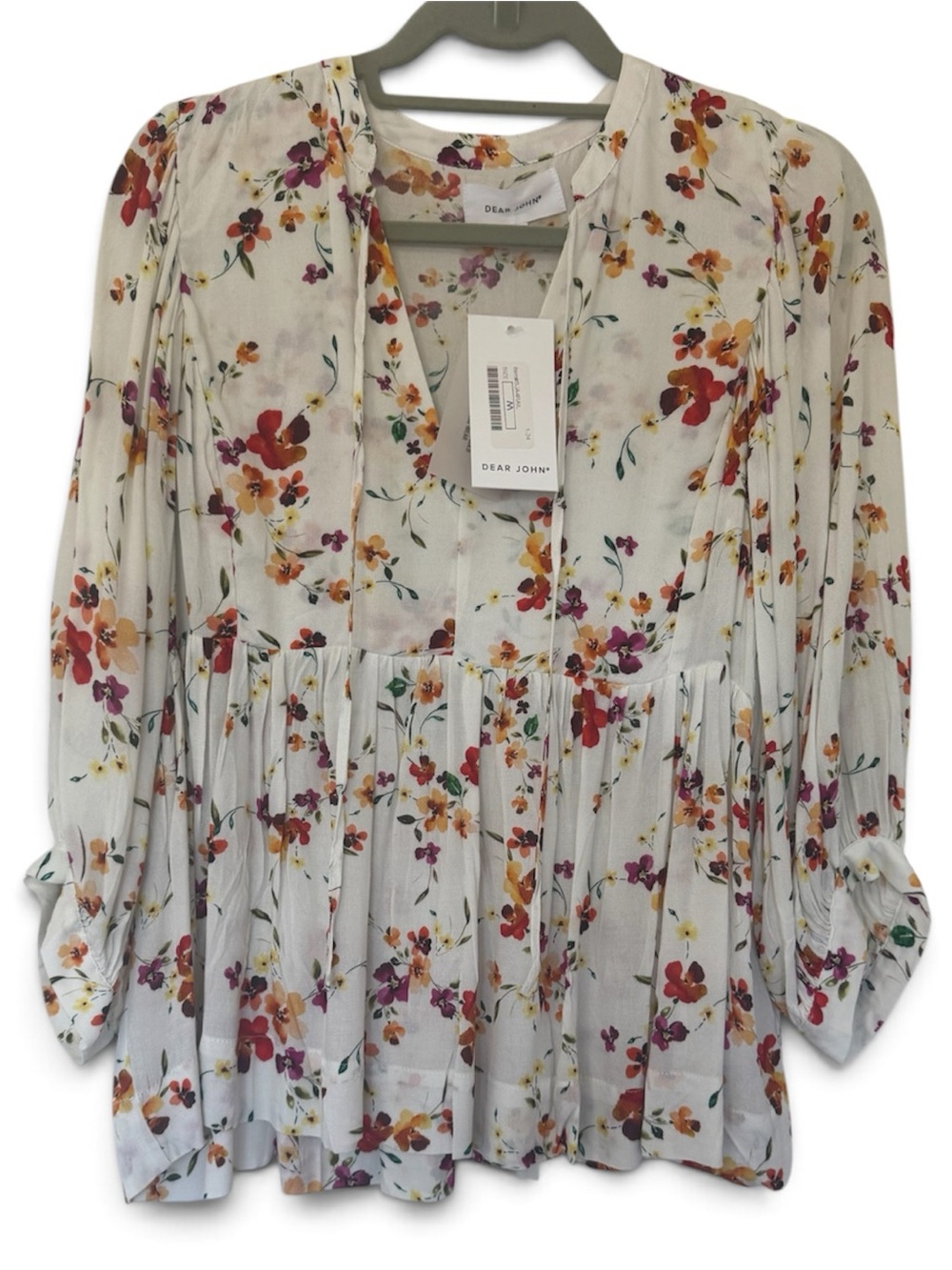This Dear John long-sleeve blouse features a delicate, multi-color floral print
